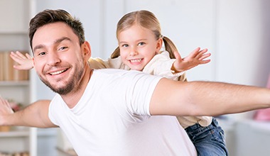 Father and daugther playing