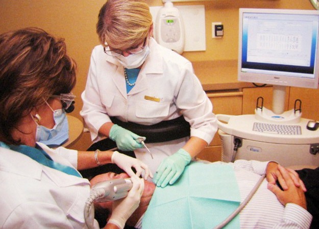 Dentist treating patient