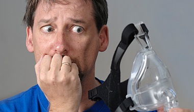 Man looking scared of CPAP system